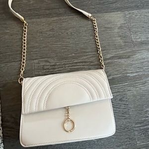 Beige purse with gold chain